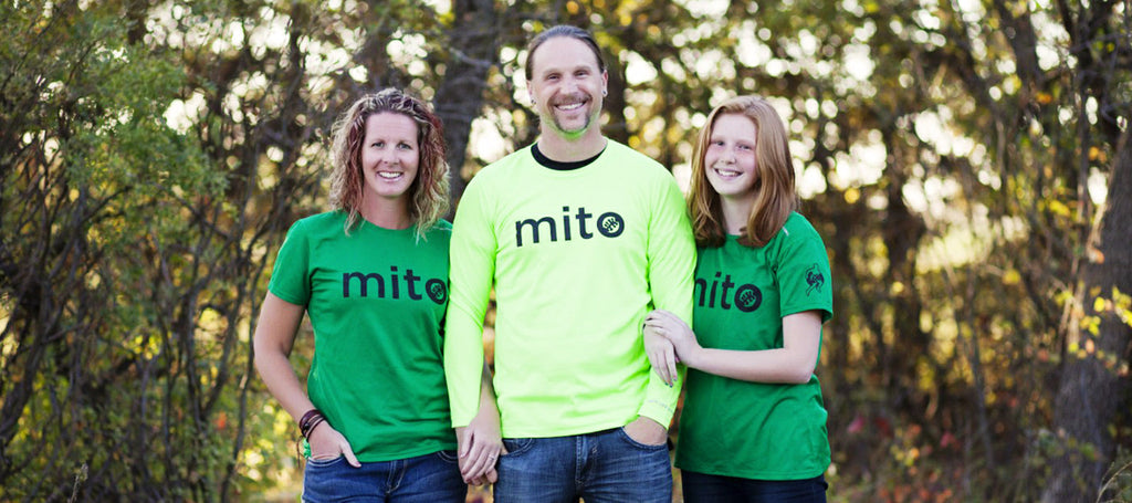 Image of a three person family wearing Mito Canada shirts.