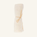 Relaxus Bamboo Face Cloth made of organic bamboo cotton, rolled and tied with a thin string.