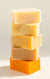 five bars of soap stacked in a column
