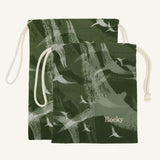 Large and small green drawstring bags with bird pattern and 'Rocky' branding on a white background