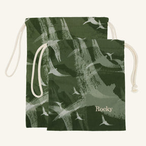 Large and small green drawstring bags with bird pattern and 'Rocky' branding on a white background