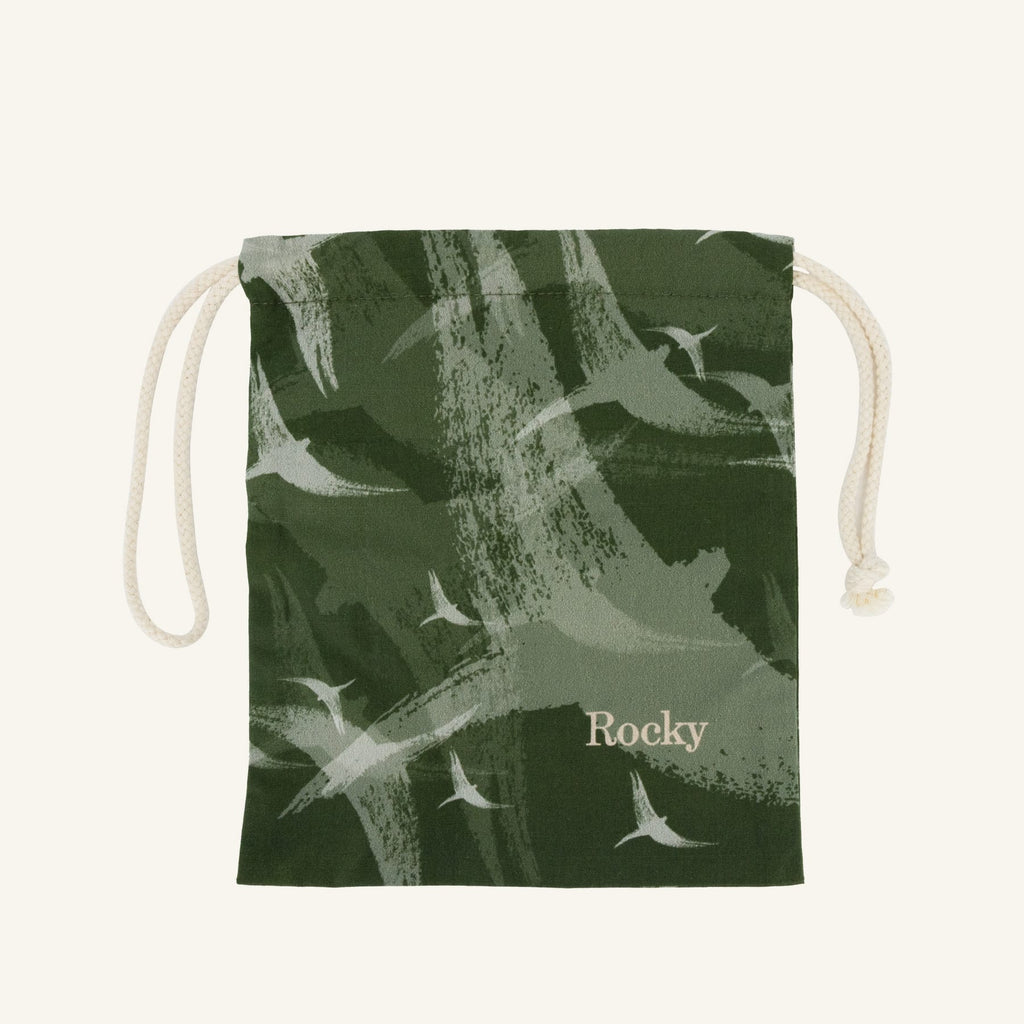 Small green drawstring bag with bird pattern and 'Rocky' branding on a white background