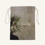 Large drawstring bag with floral design and 'Rocky' branding on a beige background
