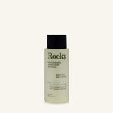 A 90ml bottle of Rocky Wild Kindness Conditioner in scent free on a cream background