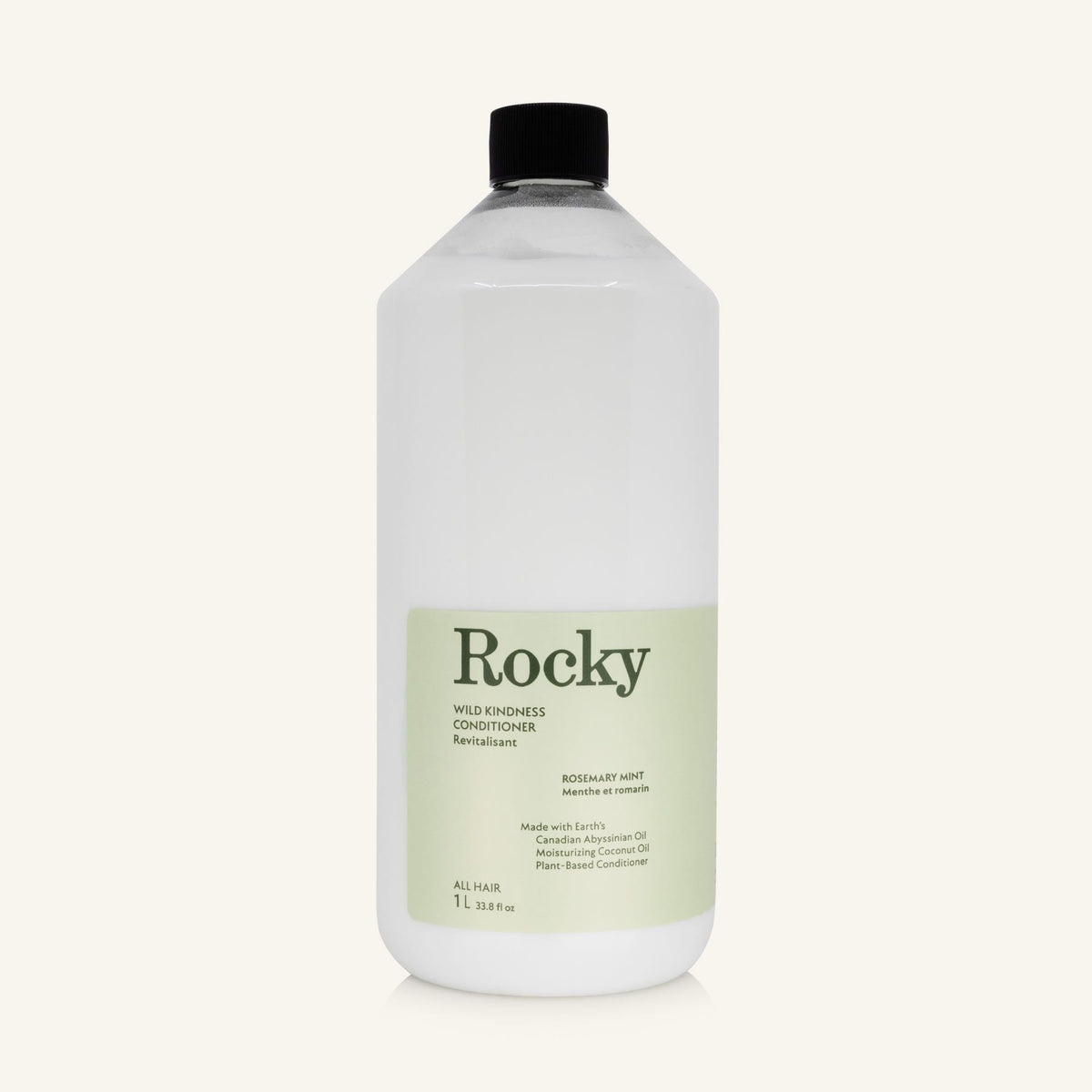 A 1L clear bottle of Rocky Wild Kindness Conditioner with a black cap and a pale green label, centered on a light cream background.