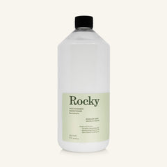 A 1L clear bottle of Rocky Wild Kindness Conditioner with a black cap and a pale green label, centered on a light cream background.