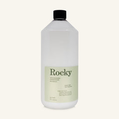 A 1L bottle of Rocky Wild Kindness Scent Free Conditioner with a black cap and a pale green label, centered on a light cream background.