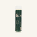 A cylindrical Rocky Mountain Soap Company Vanilla Coconut Lip Butter tube with a green label featuring white text in English and French, including a QR code.