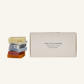 The Little Things Energizing six-piece soap sampler gift set with six mini soaps stacked beside to show their scale