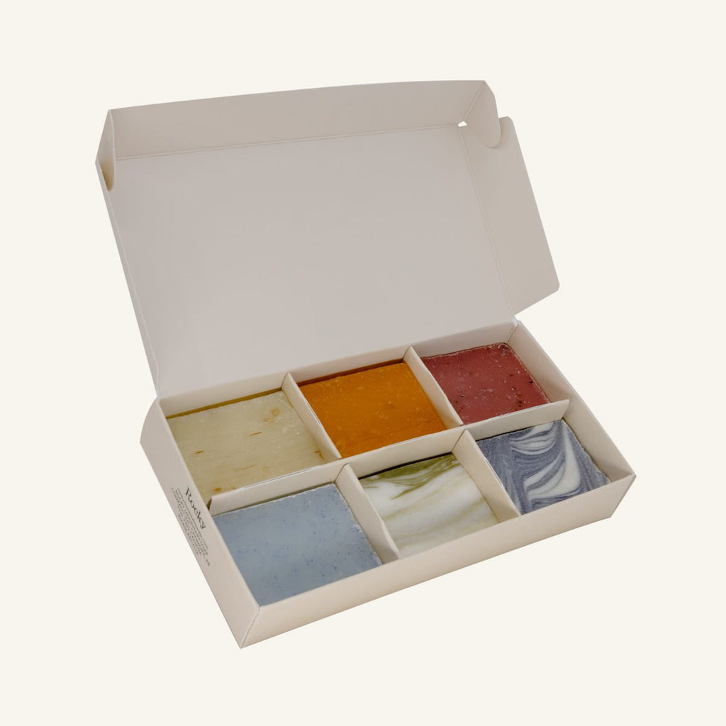 A cream gift box containing six mini bars of soap in assorted scents