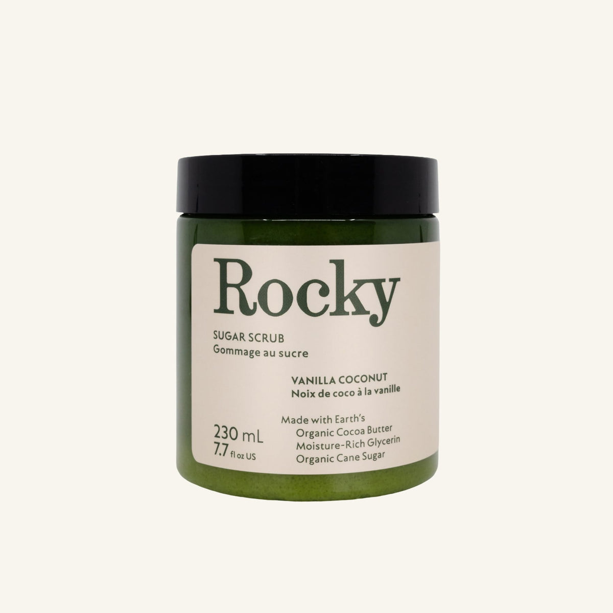 A dark green jar of Rocky Mountain Soap Company Vanilla Coconut Sugar Scrub with a black lid and a cream-colored label detailing product ingredients and volume.