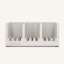 A white three-compartment soap holder with slotted bases and the name 'Rocky' embossed on the front, shown against a solid off-white background.