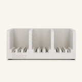 A white three-compartment soap holder with slotted bases and the name 'Rocky' embossed on the front, shown against a solid off-white background.
