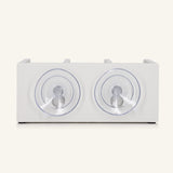 The back of the white shower shelf featuring two suction cups