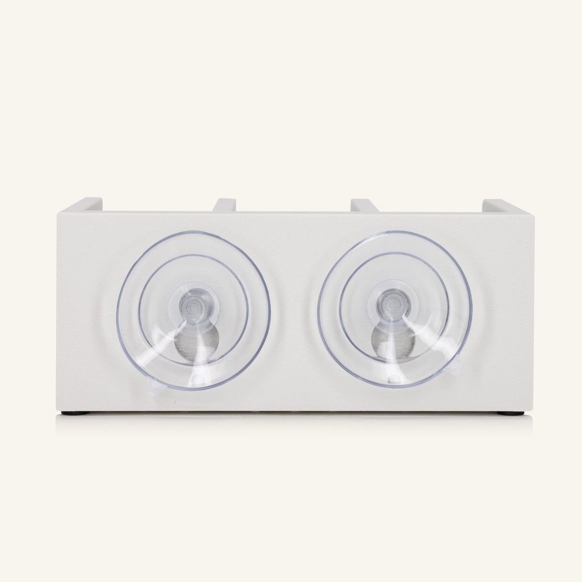 The back of the white shower shelf featuring two suction cups