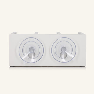 The back of the white shower shelf featuring two suction cups