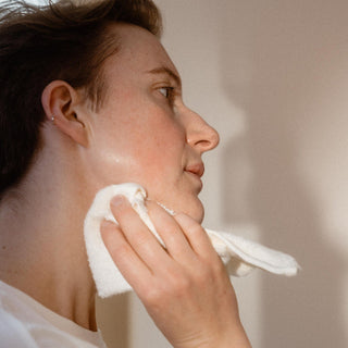 Transformative Cleansing Oil in use with washcloth
