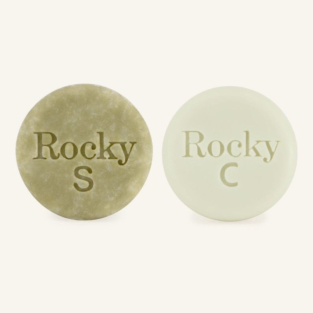 Two round solid hair bars embossed with 'Rocky'