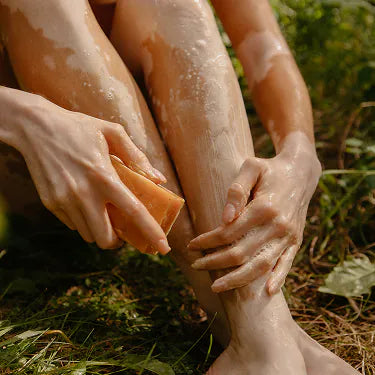 Washing with a bar of soap outdoors