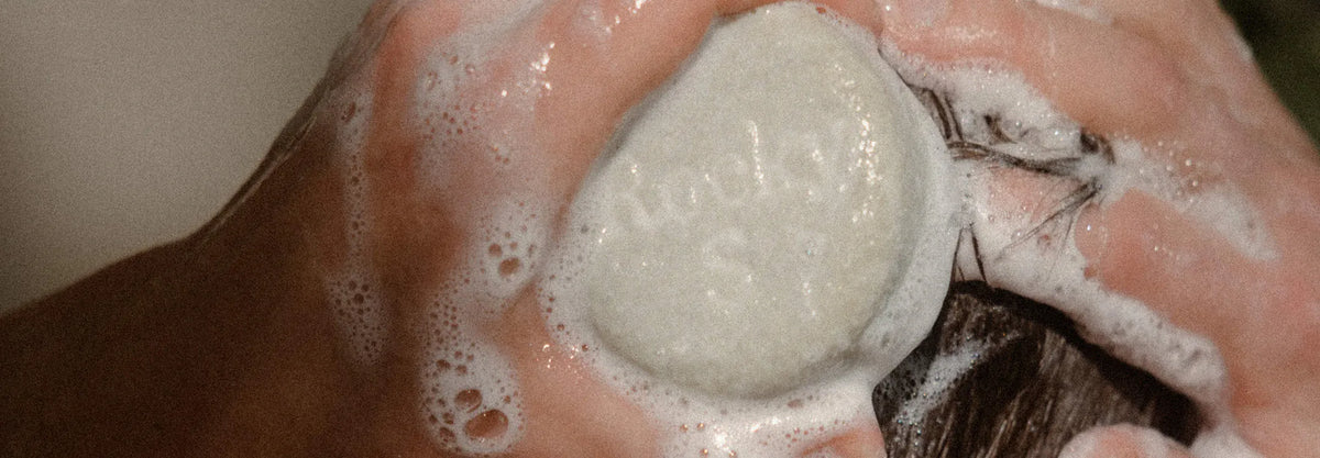 A Rocky Hair Bar lathering in wet hair
